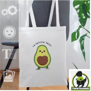 Tote bag avocat rigolo à personnaliser, motif humour avec un avocat qui attend des jumeaux, son noyau est en forme de cœur.